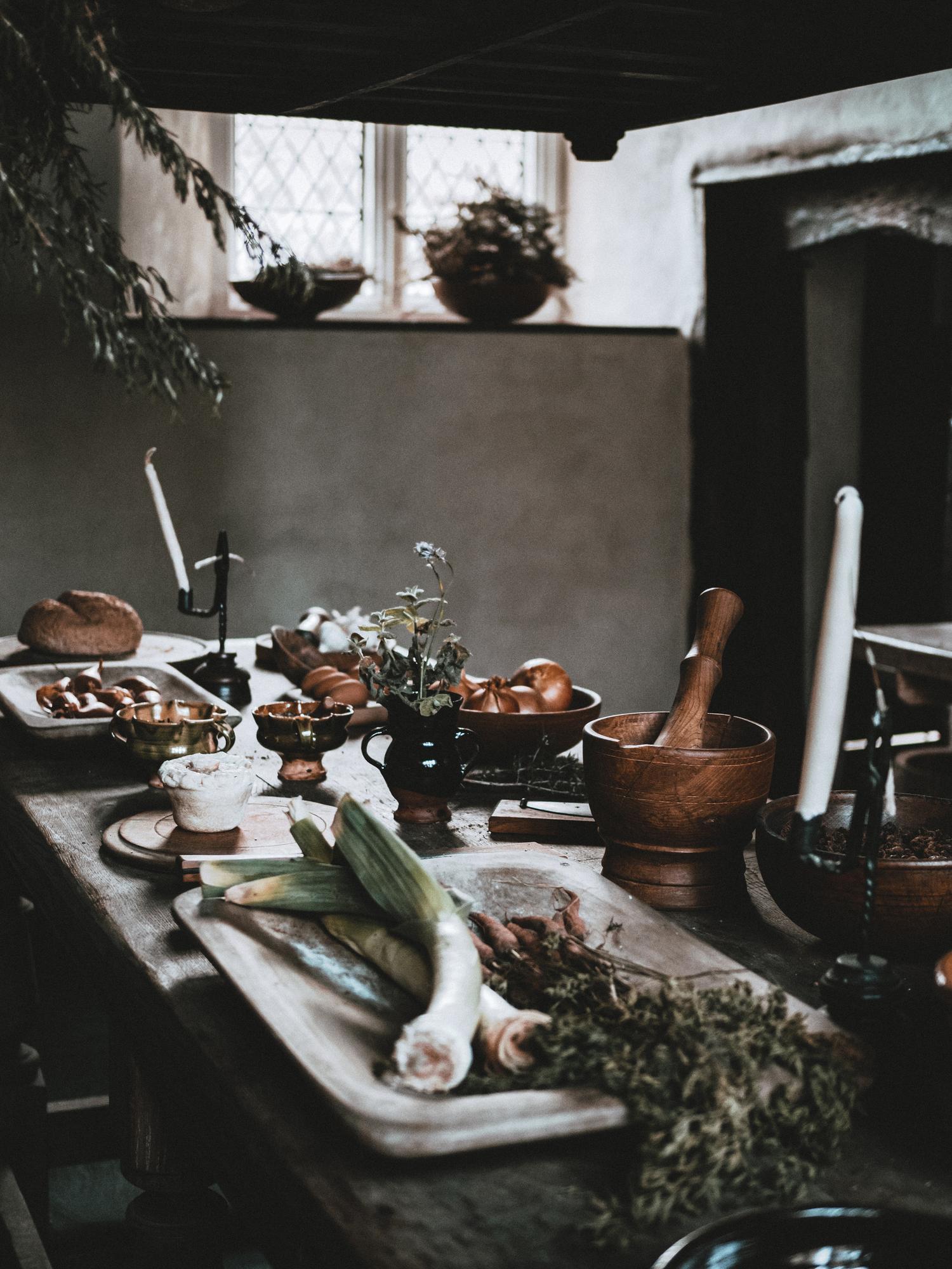 Cozy workshop kitchen with pots and herbs